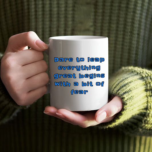 Black ceramic mug with a powerful message: "Dare to Leap - Everything Great Begins with a Bit of Fear." Enjoy your favorite hot beverage while reminding yourself to take a chance and chase your dreams.